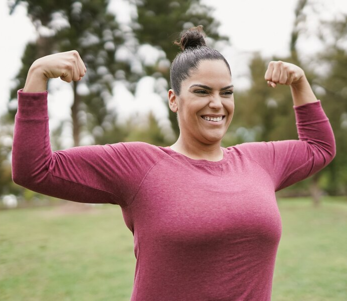 Woman flexing biceps