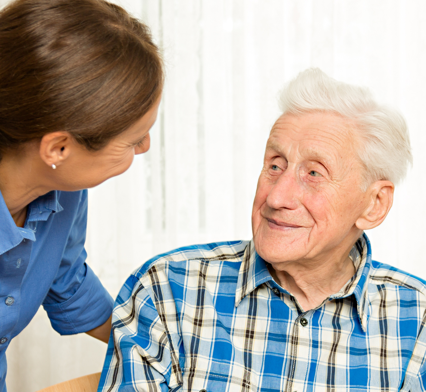 Woman looking at elderly man