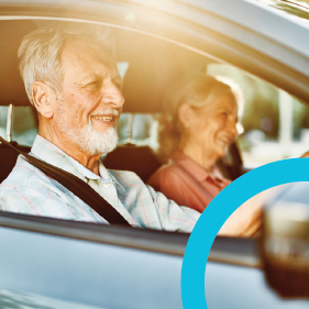 Smiling man and woman sitting in car