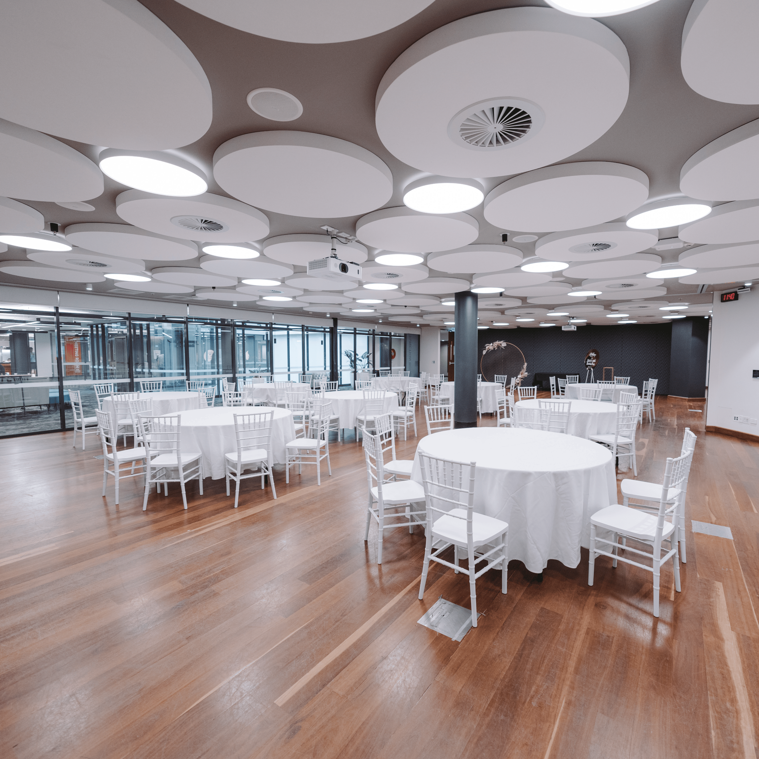 A venue space with white tables and chairs