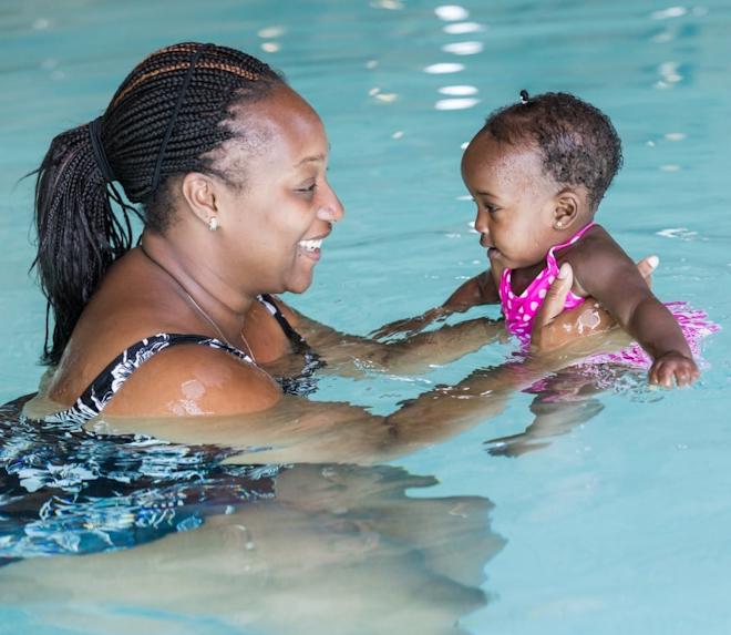 woman and baby in swimming pool