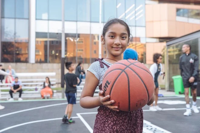 Girl holding a basketball