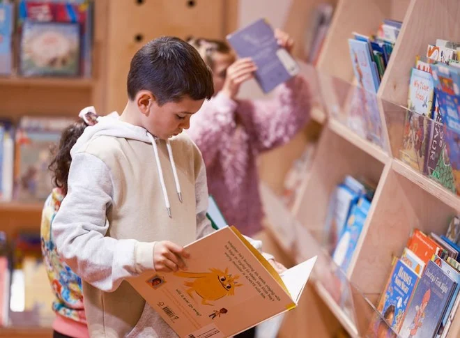 Children in library reading books